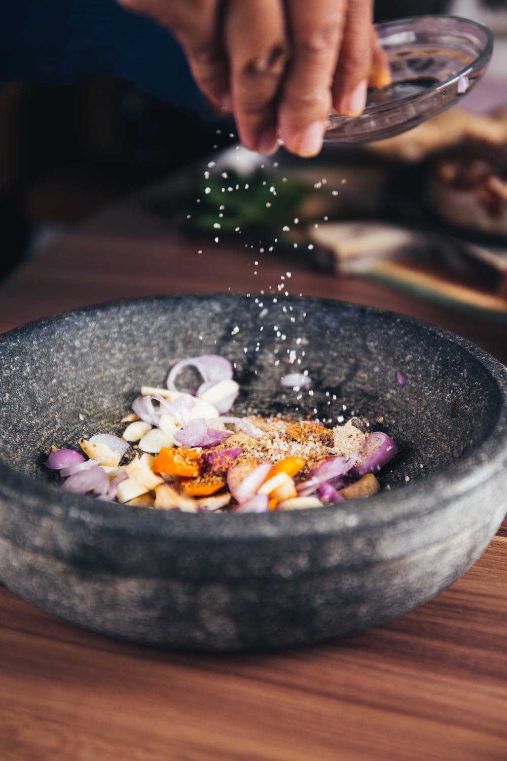 Person pouring salt